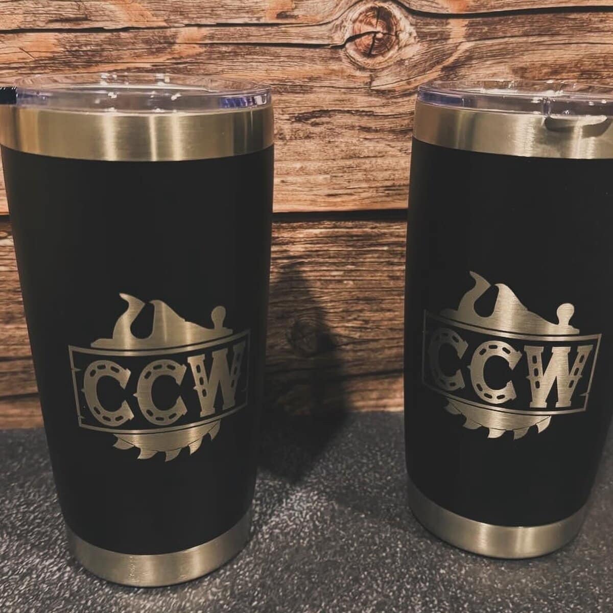 Pair of wooden tumblers engraved with a logo