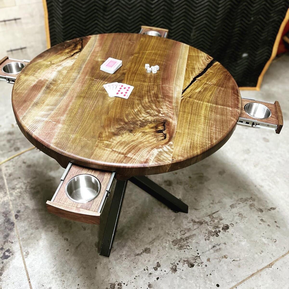 Round wooden game table with recessed drink holders