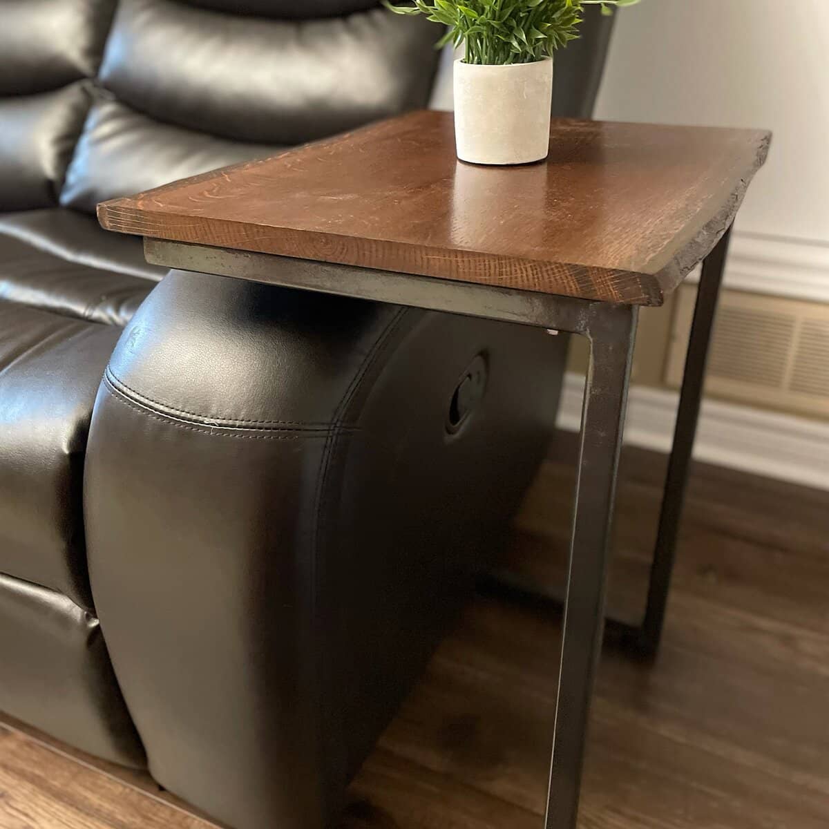 Live-edge wooden side table with black metal legs